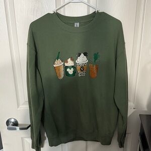Green Sweatshirt with Disney Coffee Cup Graphics